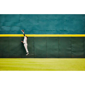 Umělecká fotografie Wide shot baseball player jumping for, Thomas Barwick, (40 x 26.7 cm)