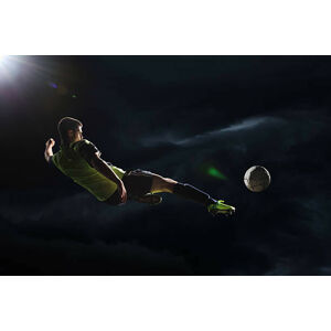 Umělecká fotografie Soccer player kicking the ball in the air, Stanislaw Pytel, (40 x 26.7 cm)