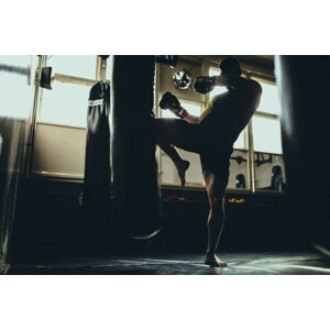 Umělecká fotografie Man kick boxer training alone in gym, South_agency, (40 x 26.7 cm)