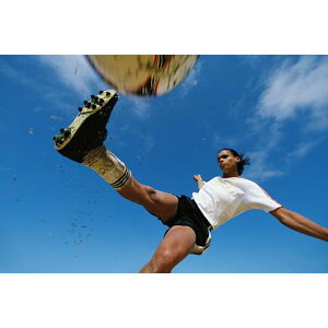 Umělecká fotografie Soccer player kicking ball, low angle, David Madison, (40 x 26.7 cm)
