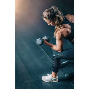 Umělecká fotografie Female Athlete Exercising with Dumbbells in, microgen, (26.7 x 40 cm)