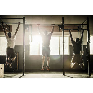 Umělecká fotografie Three men doing pull ups on, Corey Jenkins, (40 x 26.7 cm)