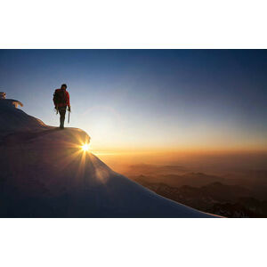Umělecká fotografie Climber on a snowy range at sunset, Buena Vista Images, (40 x 24.6 cm)
