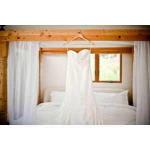 Umělecká fotografie Wedding dress hanging bed, Cavan Images, (40 x 26.7 cm)